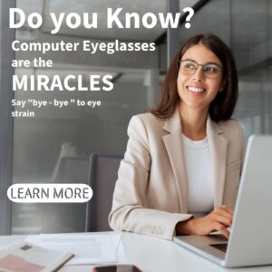 Person wearing computer eyeglasses while working on a laptop to reduce digital eye strain
