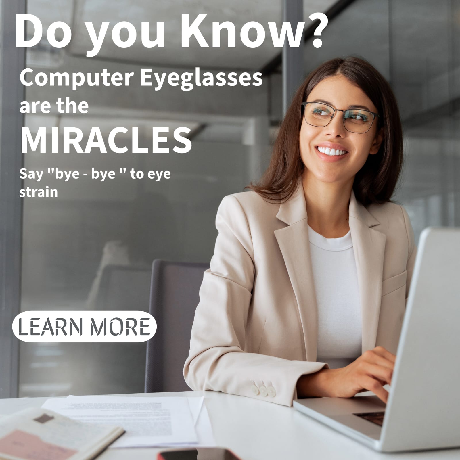 Person wearing computer eyeglasses while working on a laptop to reduce digital eye strain